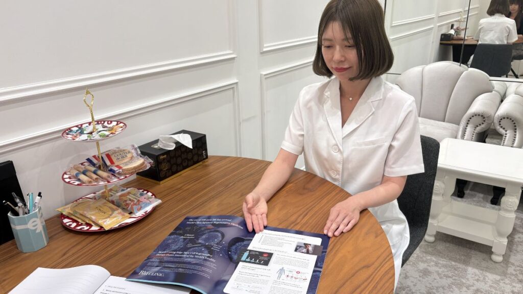 A doctor providing a medical consultation with a brochure.