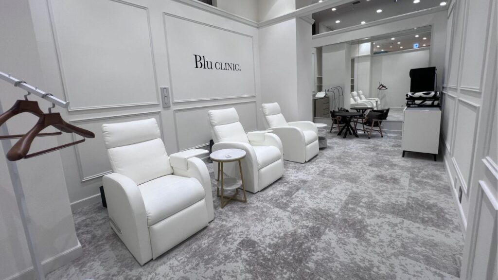 A modern, high-end private treatment room at Blu CLINIC.