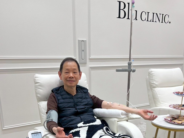 A patient receiving IV therapy in a comfortable treatment chair at Blu CLINIC.